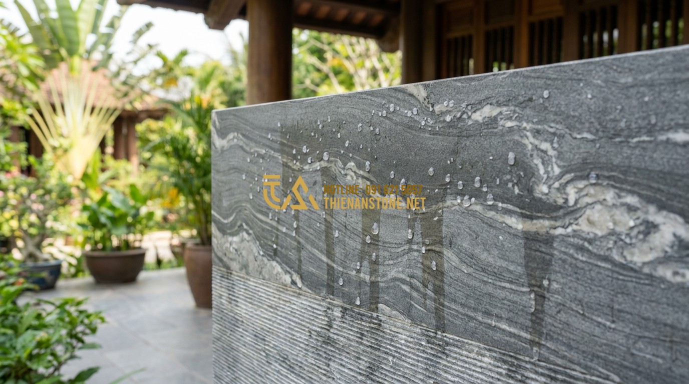 Tạo ảnh tiếng Anh: A demonstration of water beads rolling off the surface of a treated natural stone wall with comb texture. The water does not soak in, showing the superior waterproof quality. Clean, modern aesthetic, professional demonstration photography.
