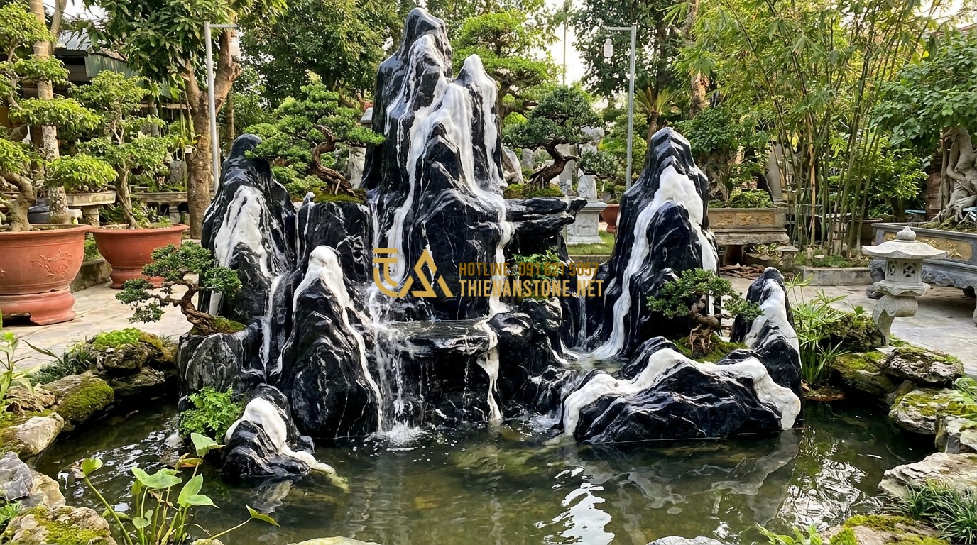 Tạo ảnh tiếng Anh: A grand miniature mountain (Hon Non Bo) made from Tuyet Son stone. Water flows down the stone crevices into a clear pond. Small bonsai trees grow on the stone ledges. The white veins look like actual flowing waterfalls or snow on the mountain peaks. Cinematic outdoor photography.