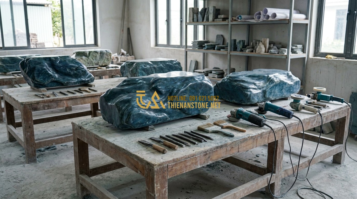 Tạo ảnh tiếng Anh: A professional team of artisans at Thien An Stone workshop carefully handling and preparing large Japanese Green Stones for a project. The workshop is clean and organized, showing traditional tools and modern equipment. The focus is on the craftsmanship and dedication to quality.