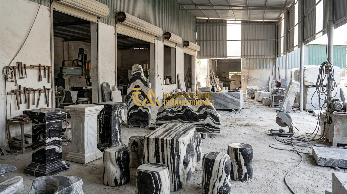 Tạo ảnh tiếng Anh: A wide panoramic shot of the Thien An Stone workshop in Phu Tho province, Vietnam. Artisans are seen working on various large stone products like pedestals, stools, and sculptures. The workshop is organized, featuring both traditional tools and modern machinery. Authentic industrial atmosphere, bright daylight.