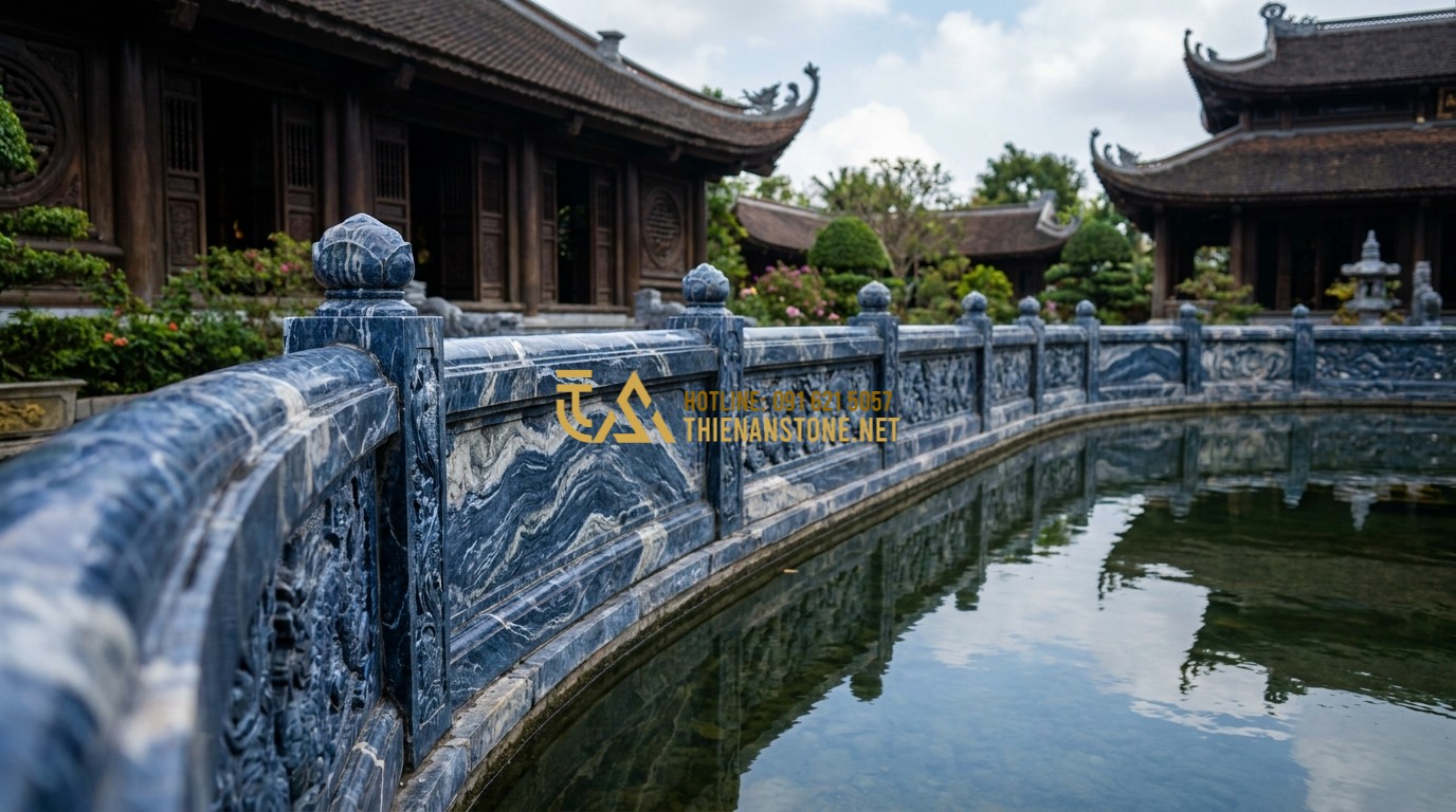 Tạo ảnh tiếng Anh: A long row of blue stone balustrades installed along a traditional Vietnamese temple pond. The reflection of the stone carvings is visible in the clear water. Traditional wooden architecture in the background, cinematic atmosphere, high detail.
