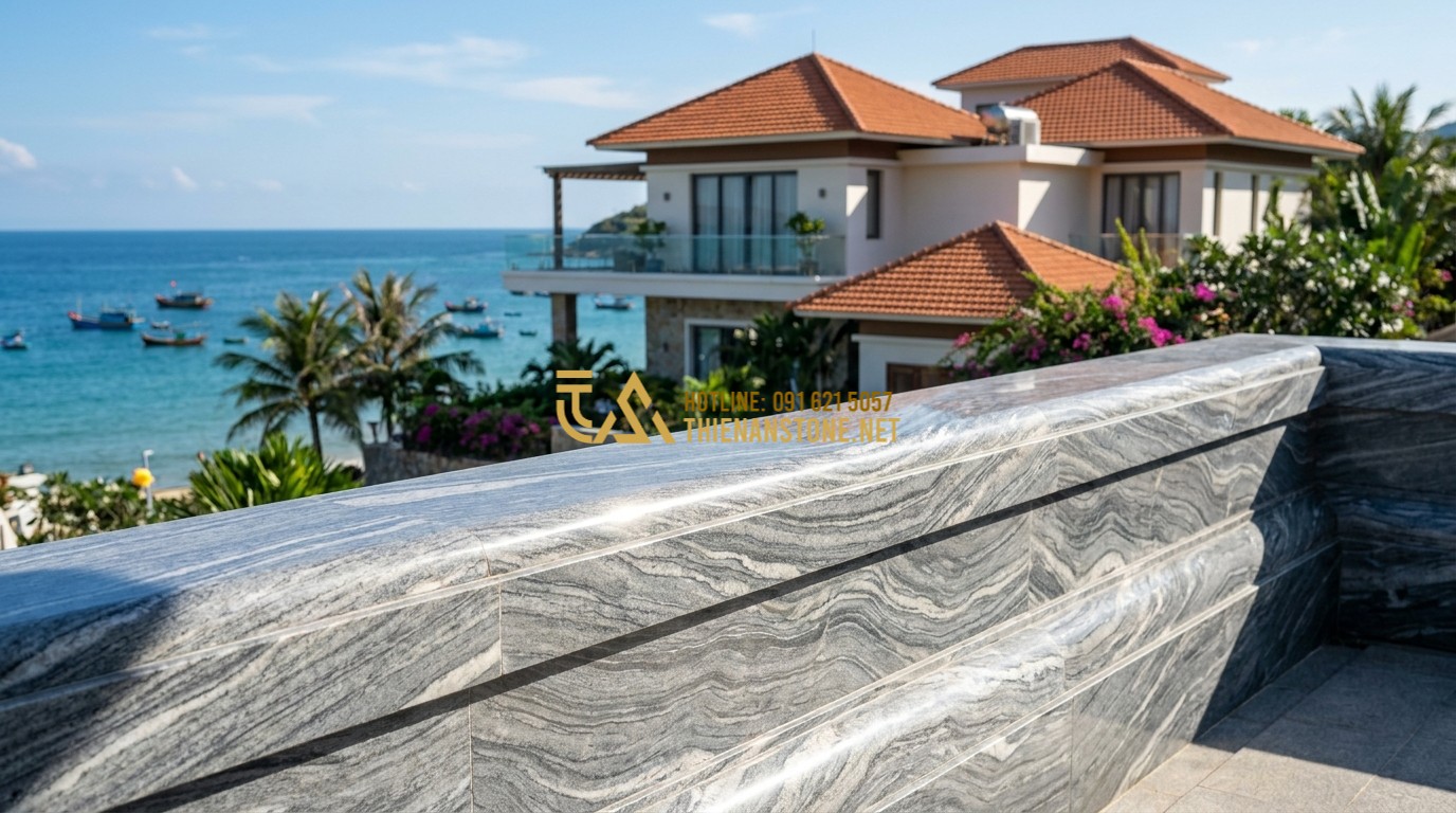 Tạo ảnh tiếng Anh: Modern balcony featuring a granite stone balustrade with a polished grey finish. The background shows a high-end seaside villa with blue ocean views. The sunlight reflects off the stone's crystalline surface, highlighting its strength and durability.