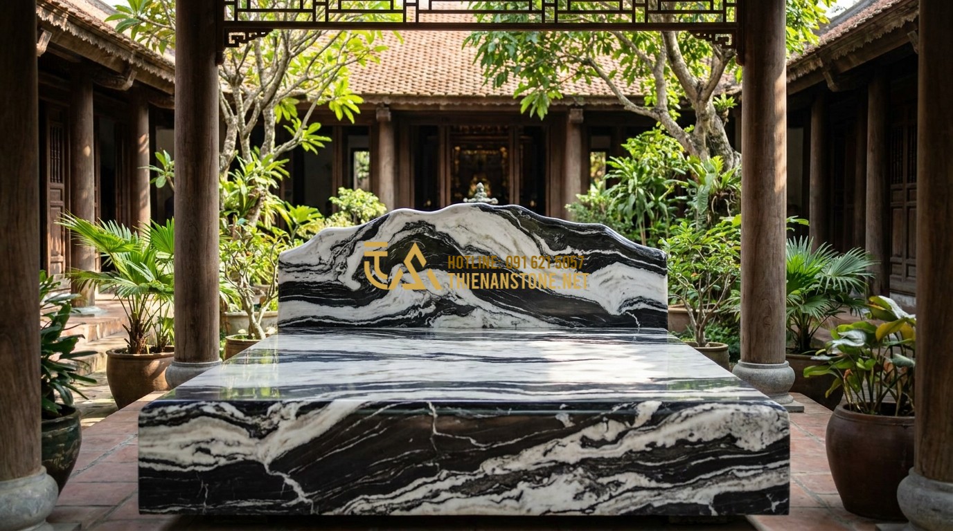 Tạo ảnh tiếng Anh: A majestic natural stone bed (Sap Da) carved from a single large block of green marble, placed in a traditional Vietnamese courtyard with ancient wooden architecture. The stone has deep natural veins. Sunlight filters through the trees, highlighting the polished surface. Professional photography, architectural style, cinematic lighting.