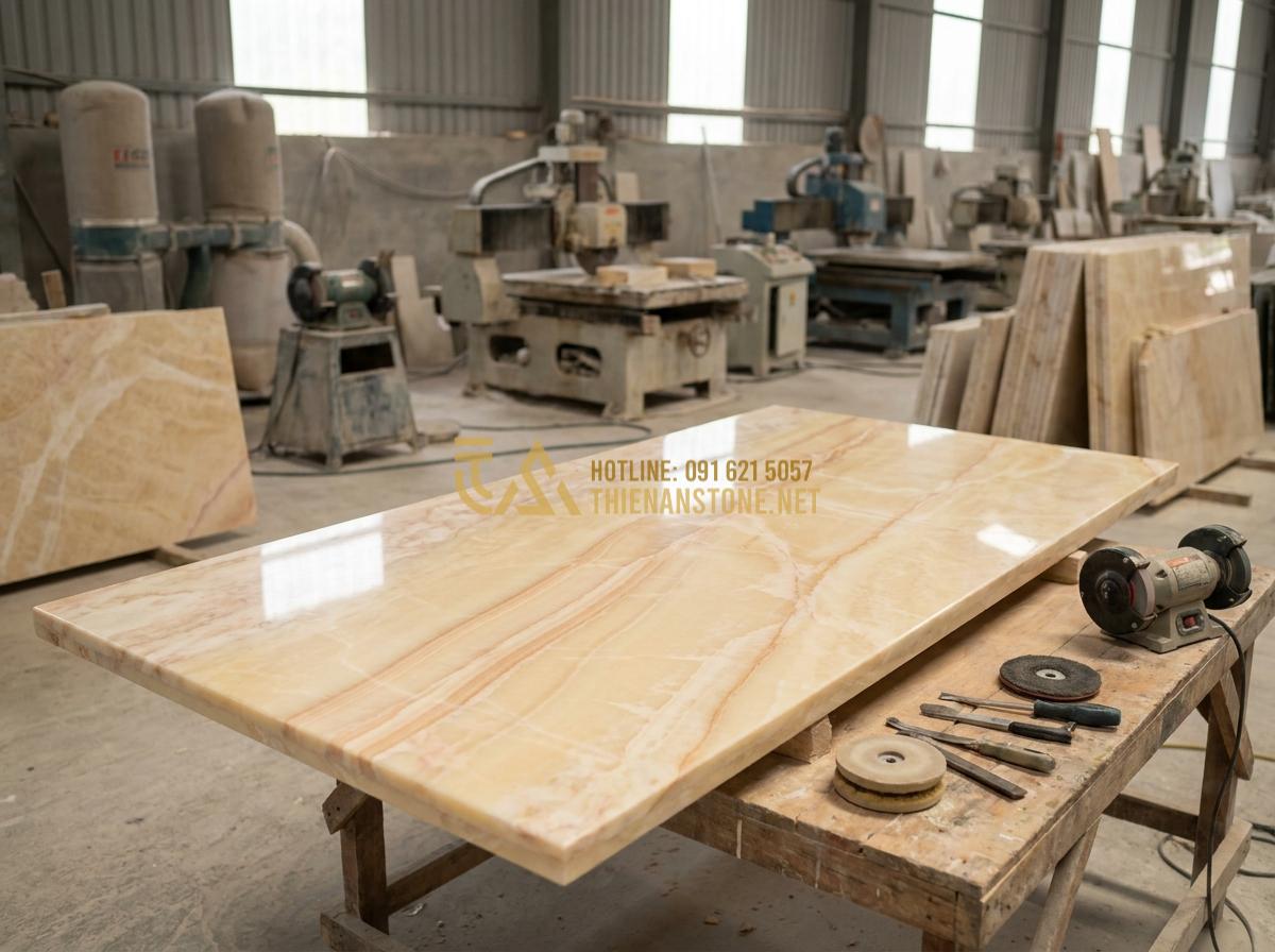 Tạo ảnh tiếng Anh: Behind-the-scenes professional image of skilled Vietnamese artisans at a stone workshop carefully polishing a large granite dining table, modern machinery in background, detailed craftsmanship visible, natural workshop lighting, high resolution documentary photography style, inspiring and authentic atmosphere