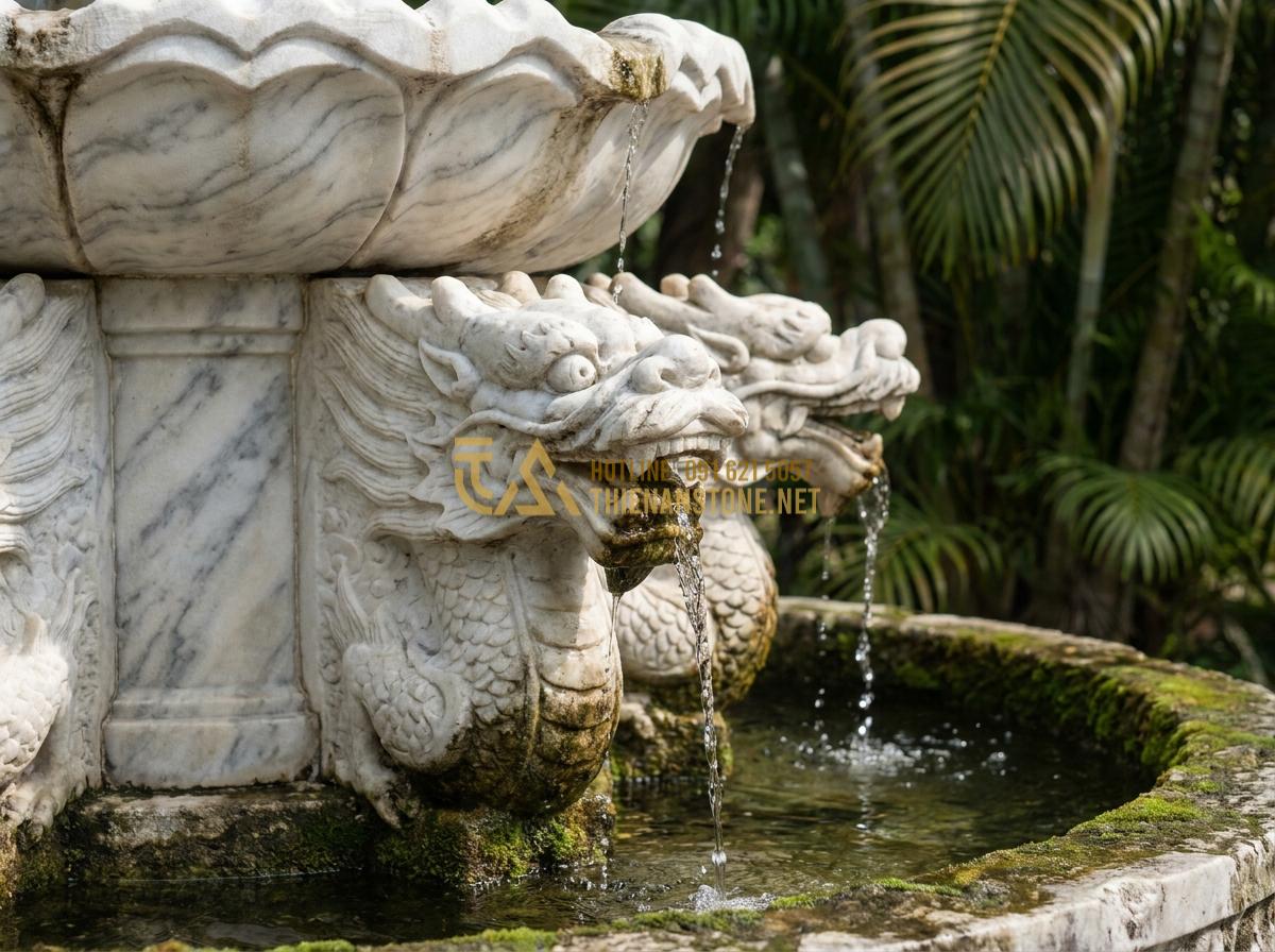 Tạo ảnh tiếng Anh: Close-up professional image of intricately hand-carved natural stone water fountain details showing dragon motifs and flowing water, realistic texture of granite stone, soft lighting highlighting carvings, high detail photography, artistic composition