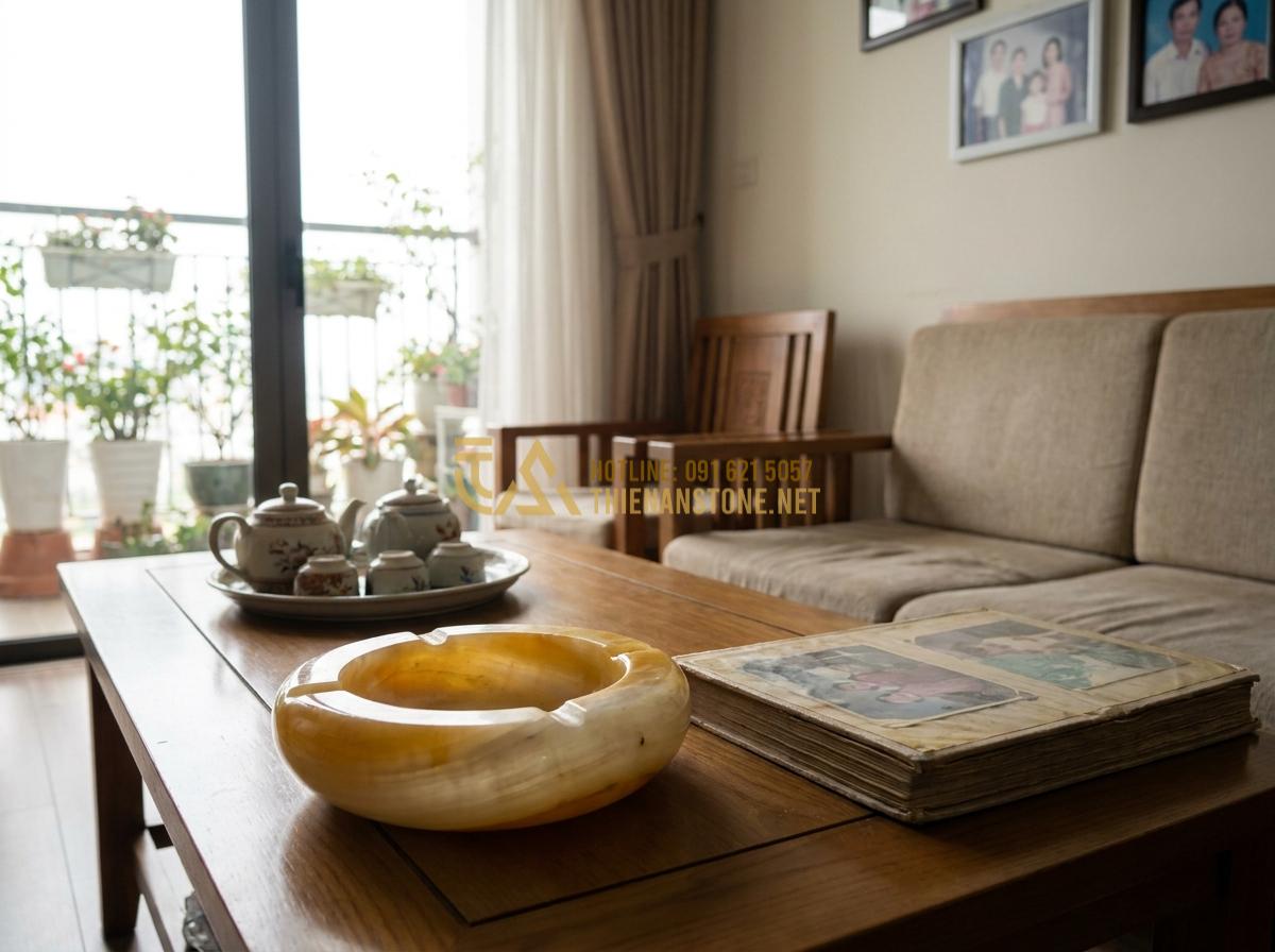 Tạo ảnh tiếng Anh: Heartwarming customer testimonial style image featuring happy Vietnamese family using a stone ashtray in their living room, smiling and relaxed atmosphere, natural home setting with warm lighting, realistic lifestyle photography capturing genuine emotion and satisfaction