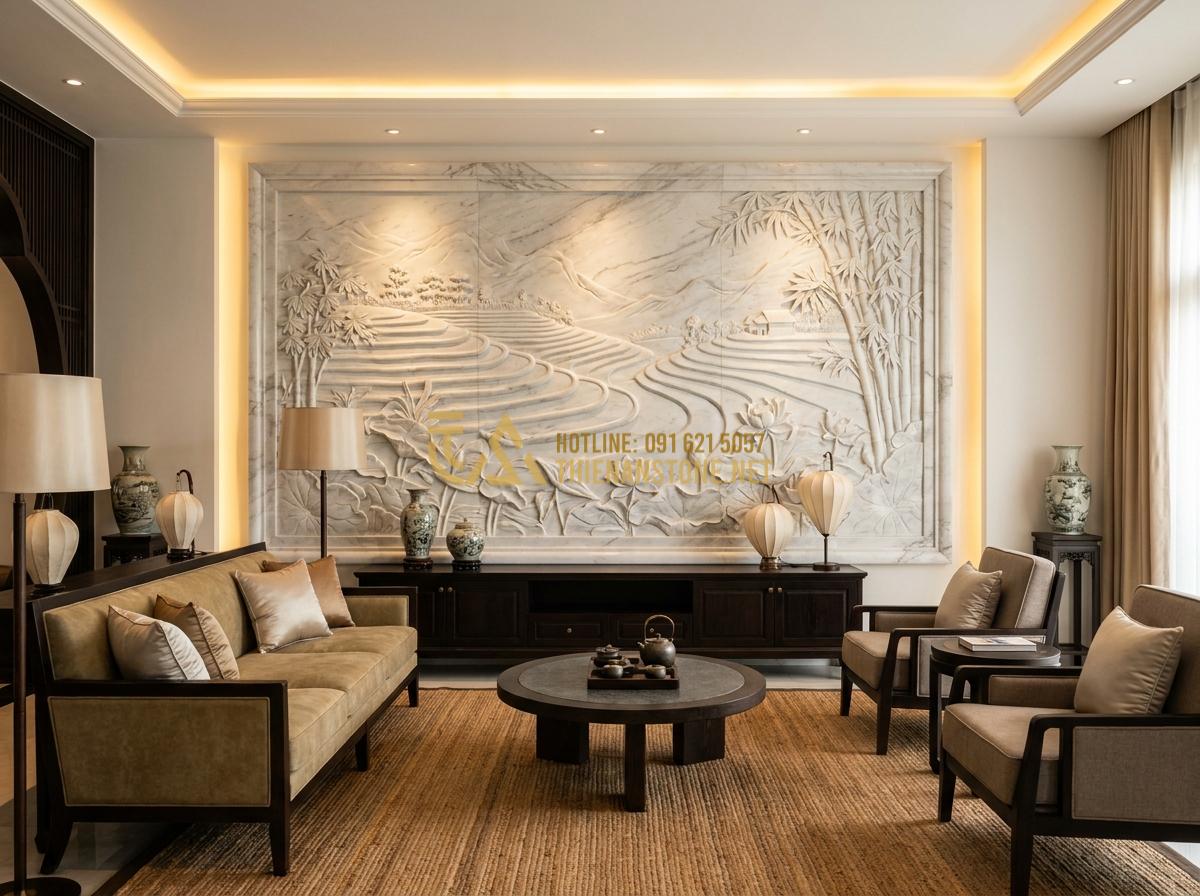 Create a luxurious professional interior photo of a modern living room featuring a large natural stone bas-relief wall panel with floral and landscape motifs, warm ambient lighting, high-end furniture, elegant Vietnamese style interior, realistic 8k detail showing stone texture and depth
