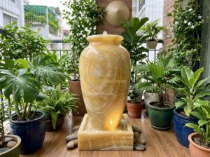 Ang Nước Bằng Đá Cho Sân Vườn Nhỏ Và Ban Công: Top Mẫu Đẹp Giá Tốt - Elegant natural granite stone water urn with gentle cascading water placed in a