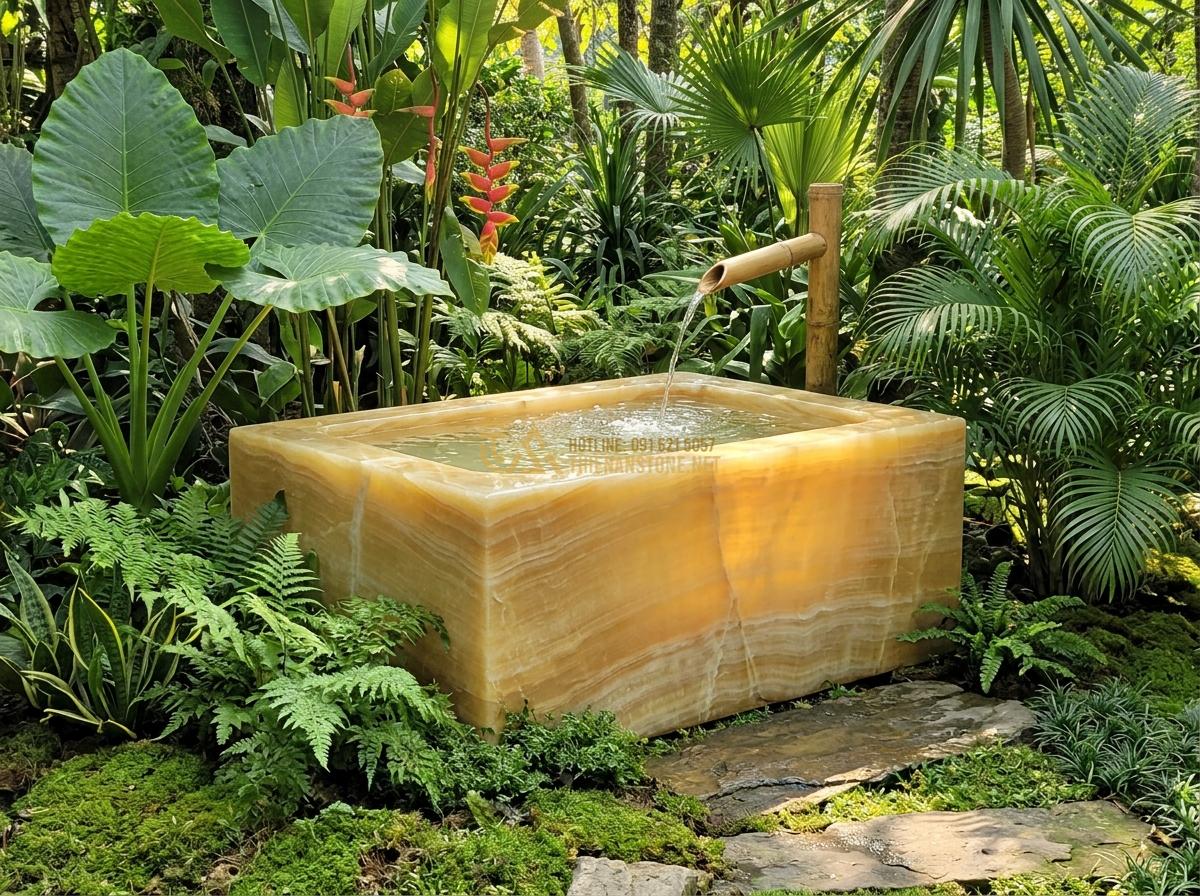 Ang Nước Bằng Đá Nguyên Khối Có Tốt Không? Ưu Nhược Điểm Thực Tế 2026 - A massive monolithic natural stone water basin carved from a single block of gra