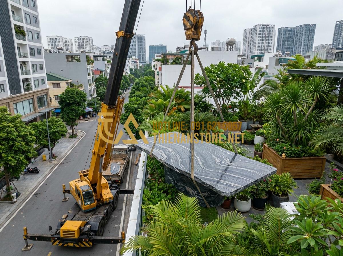 Báo giá bàn trà bằng đá tự nhiên 2026: Mua ở đâu uy tín, giá tốt? - Tạo ảnh tiếng Anh: A truck with a heavy crane lifting a large stone table into a