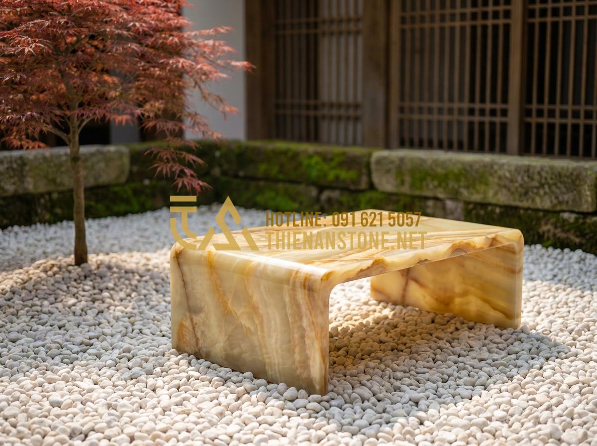Báo giá bàn trà bằng đá tự nhiên 2026: Mua ở đâu uy tín, giá tốt? - Tạo ảnh tiếng Anh: A minimalist Zen garden featuring a dark basalt stone tea tab