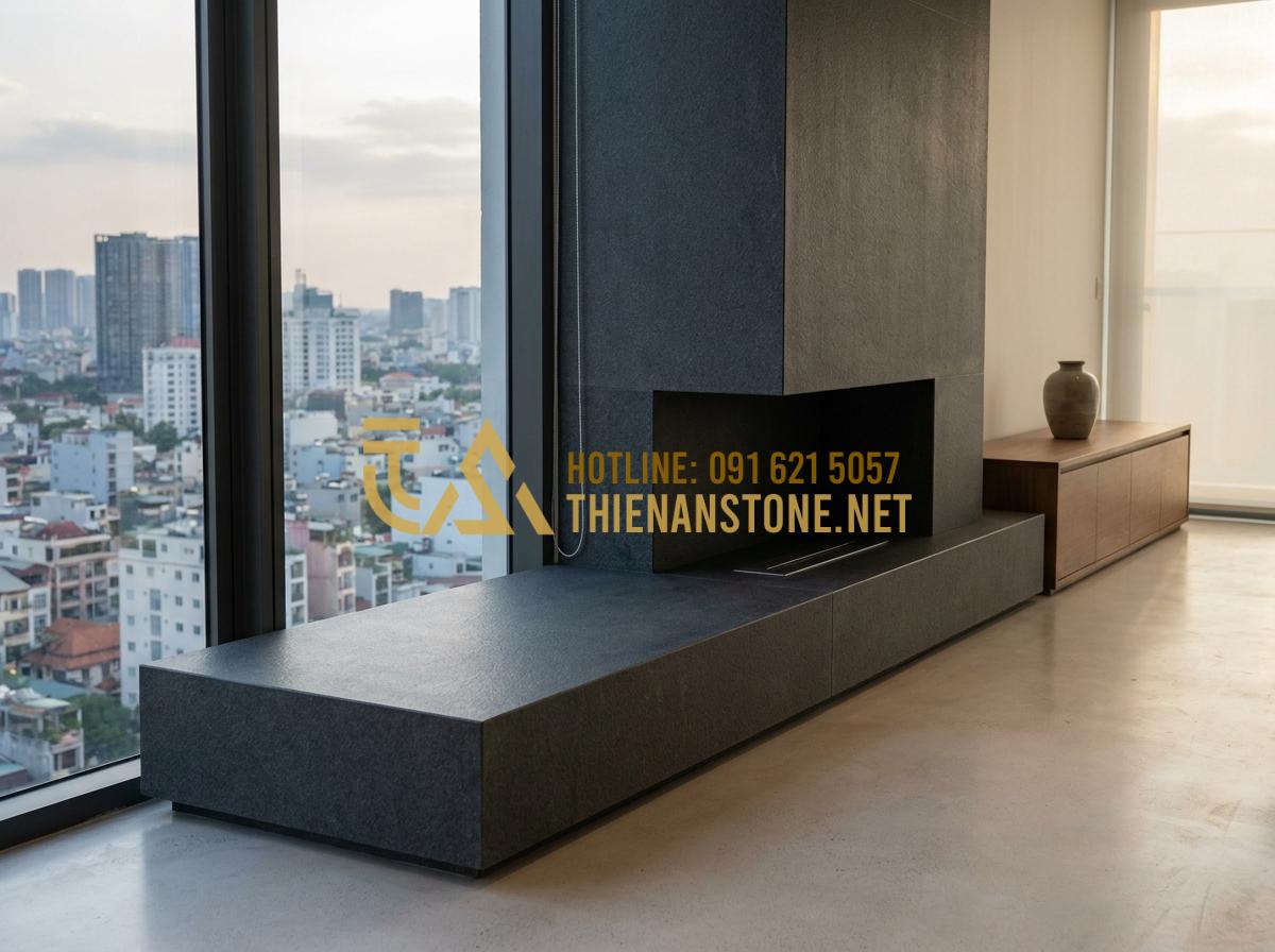 Báo Giá Lò Sưởi Đốt Củi & Chi Phí Thi Công Ốp Đá Trọn Gói 2026 - Tạo ảnh tiếng Anh: A sleek and minimalist stone fireplace in a high-end apartmen