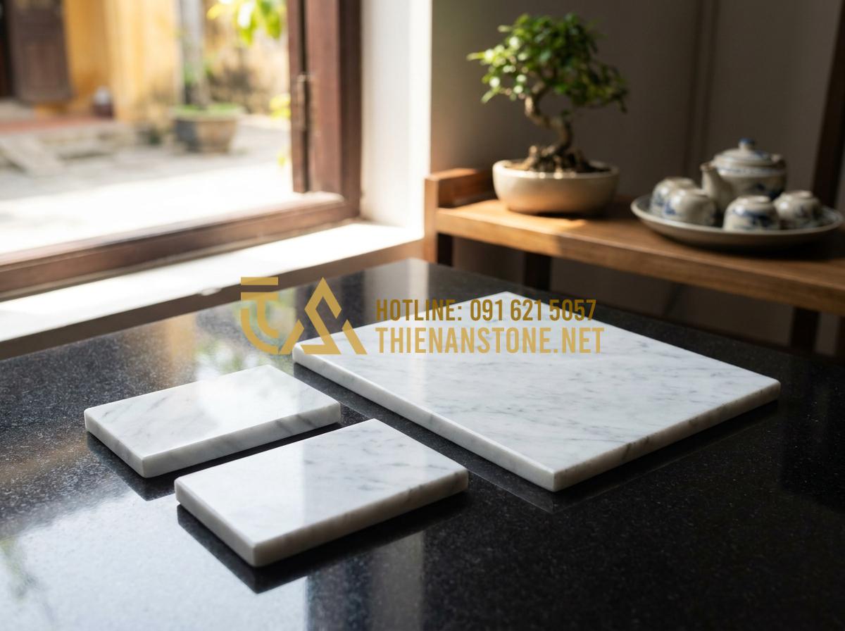 Báo giá tranh đá tự nhiên 2026: Chi phí thi công trọn gói bao nhiêu? - Tạo ảnh tiếng Anh: A high-end business card and a brochure of "Thien An Stone" p