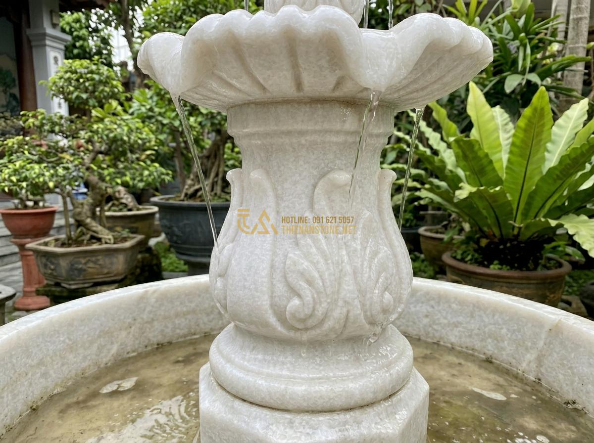 Cách Bảo Dưỡng Đài Phun Nước Bằng Đá Tự Nhiên Để Luôn Bền Đẹp Theo Thời Gian - Deep cleaning process of natural stone fountain showing scrubbing with soft brus