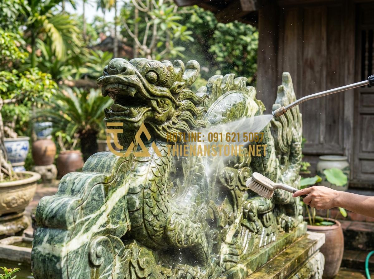 Chiếu Rồng Đá Là Gì? Ý Nghĩa Tâm Linh Và Vị Trí Đặt Chuẩn Phong Thủy - Tạo ảnh tiếng Anh: A person cleaning a stone dragon screen using a pressure wash