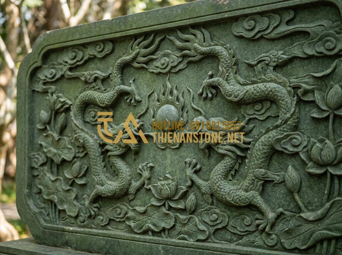 Cuốn Thư Đá Xanh Rêu: Tại Sao Lại Là Lựa Chọn Hàng Đầu Cho Công Trình Tâm Linh? - Hình 2 Cuốn Thư Đá Xanh Rêu: Tại Sao Lại Là Lựa Chọn Hàng Đầu Cho Công Trình Tâm Linh? - Tạo ảnh tiếng Anh: Close-up of spiritual carvings on a moss green stone screen,