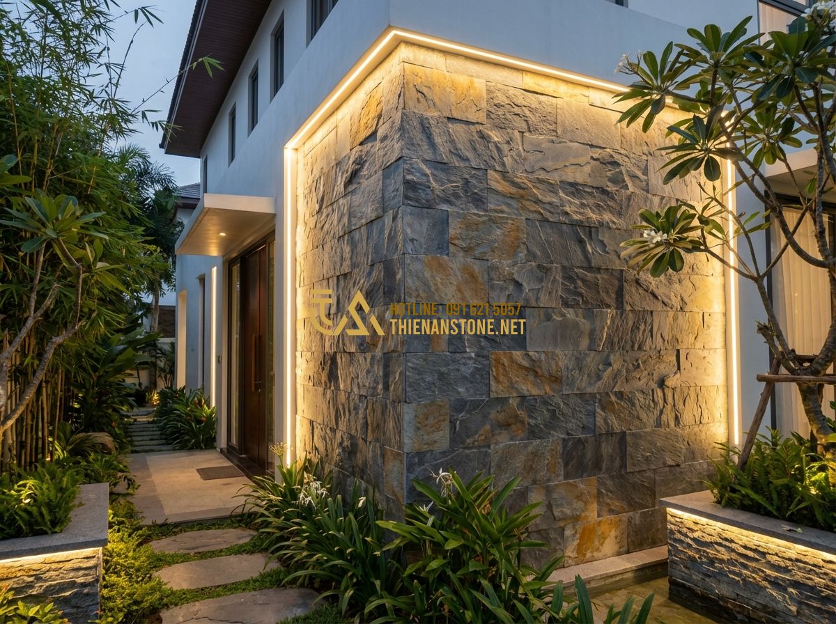 Đá Ghép Ốp Tường Có Nên Làm Không? Lưu Ý Quan Trọng Khi Thi Công - Hình 1 Đá Ghép Ốp Tường Có Nên Làm Không? Lưu Ý Quan Trọng Khi Thi Công - Tạo ảnh tiếng Anh: A high-end luxury villa facade featuring a large accent wall