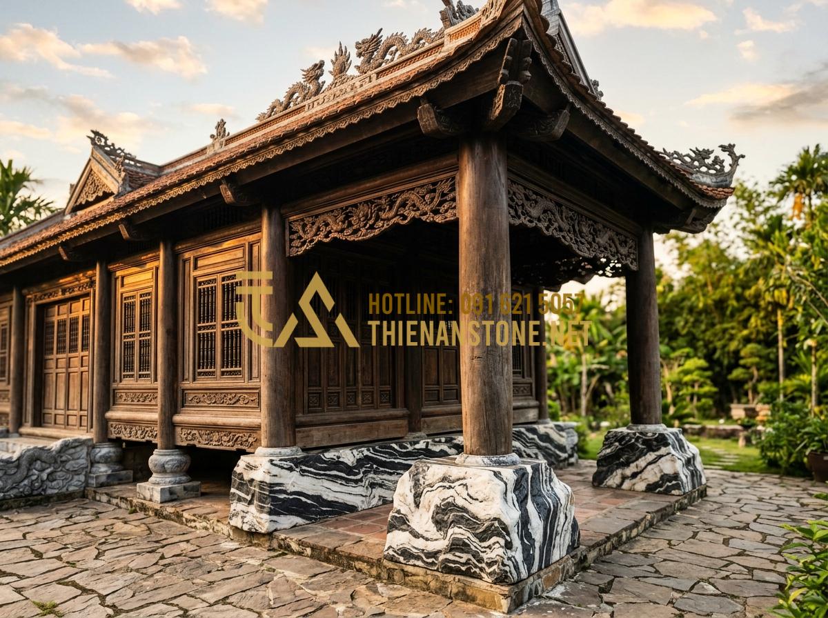 Đá kê chân cột nhà gỗ: Giải pháp bảo vệ cột gỗ bền bỉ khỏi ẩm mốc - Hình 1 Đá kê chân cột nhà gỗ: Giải pháp bảo vệ cột gỗ bền bỉ khỏi ẩm mốc - Tạo ảnh tiếng Anh: A high-quality professional photograph of a traditional Vietn