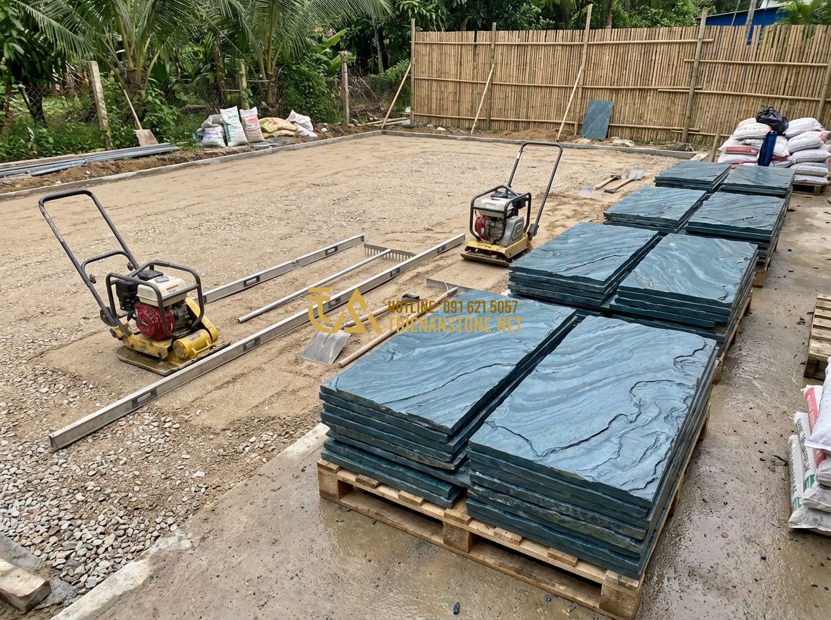 Đá Xanh Nhật Bản Lát Sân Vườn: Lợi Ích, Mẫu Đẹp Và Hướng Dẫn Thi Công Chuyên Nghiệp - Tạo ảnh tiếng Anh: A step-by-step construction site photo showing workers prepar