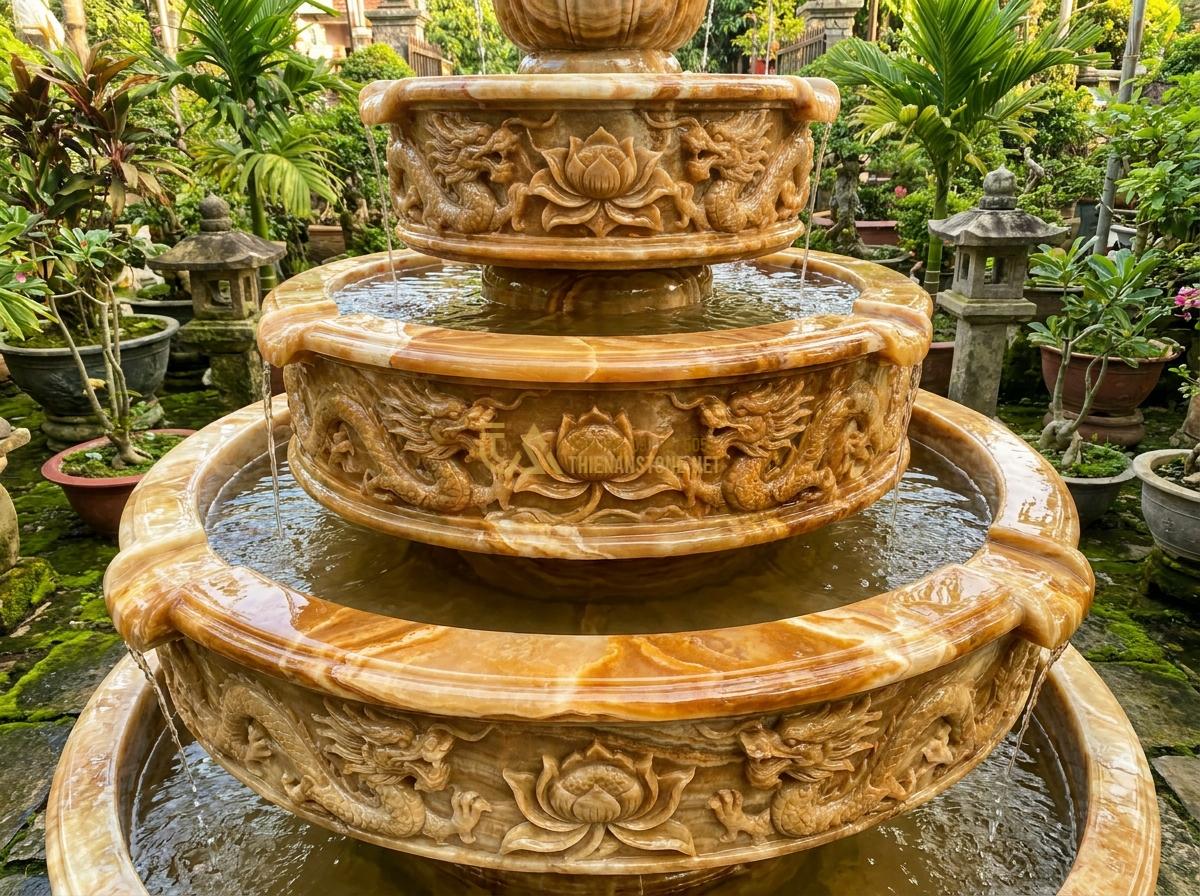 Đài Phun Nước Bằng Đá Phong Thủy: Ý Nghĩa, Cách Bố Trí & Lợi Ích Mang Lại Tài Lộc - Traditional Vietnamese style stone fountain with multi-level tiers, ornate carvi