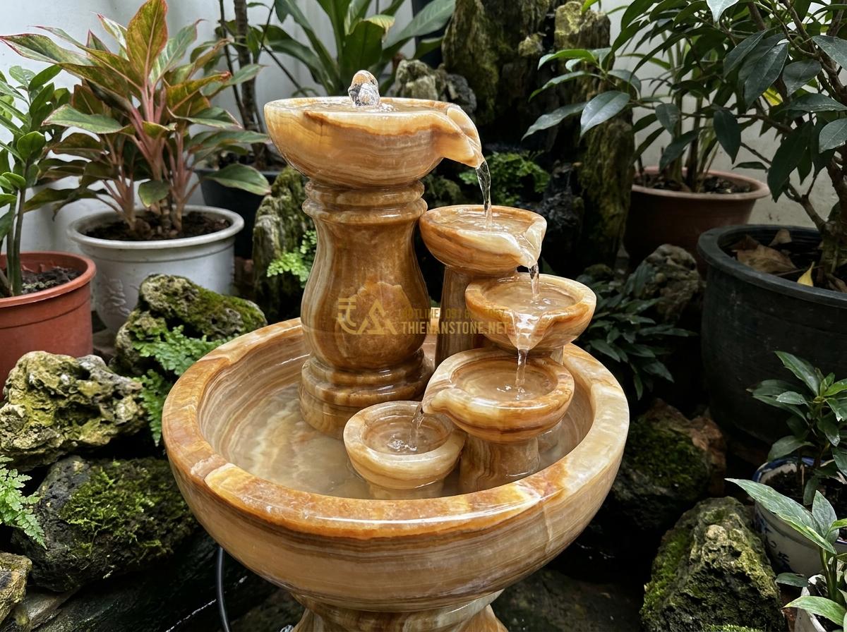Đài Phun Nước Mini Bằng Đá Tự Nhiên: Mẫu Đẹp, Giá Rẻ Cho Không Gian Nhỏ & Để Bàn - Hình 14 Đài Phun Nước Mini Bằng Đá Tự Nhiên: Mẫu Đẹp, Giá Rẻ Cho Không Gian Nhỏ & Để Bàn - Completed mini stone water fountain installed in small garden corner with perfec