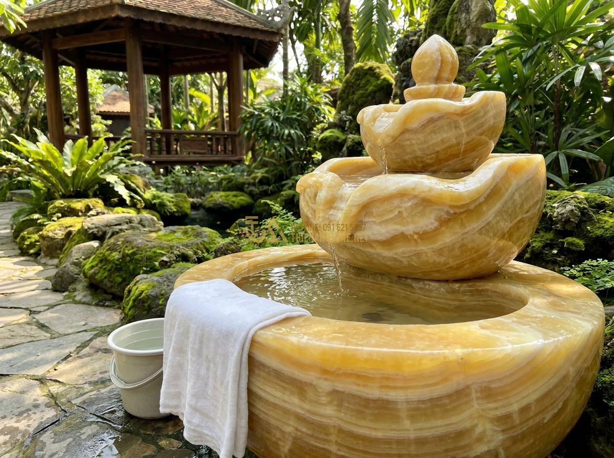 Đài Phun Nước Mini Bằng Đá Tự Nhiên: Mẫu Đẹp, Giá Rẻ Cho Không Gian Nhỏ & Để Bàn - Hình 15 Đài Phun Nước Mini Bằng Đá Tự Nhiên: Mẫu Đẹp, Giá Rẻ Cho Không Gian Nhỏ & Để Bàn - Maintenance tips showing cleaning a small stone fountain with soft cloth and fre