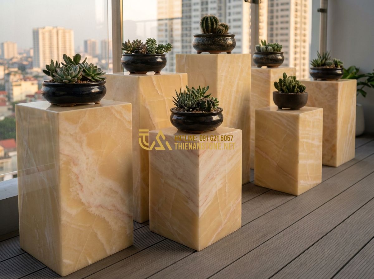 Đôn Đá Tự Nhiên Đẹp 2026: 120+ Mẫu Đôn Đá Kê Cây Cảnh, Kê Tượng Sang Trọng & Bền Đẹp - Hình 5 Đôn Đá Tự Nhiên Đẹp 2026: 120+ Mẫu Đôn Đá Kê Cây Cảnh, Kê Tượng Sang Trọng & Bền Đẹp - Tạo ảnh tiếng Anh: A stylish apartment balcony with a collection of small potted