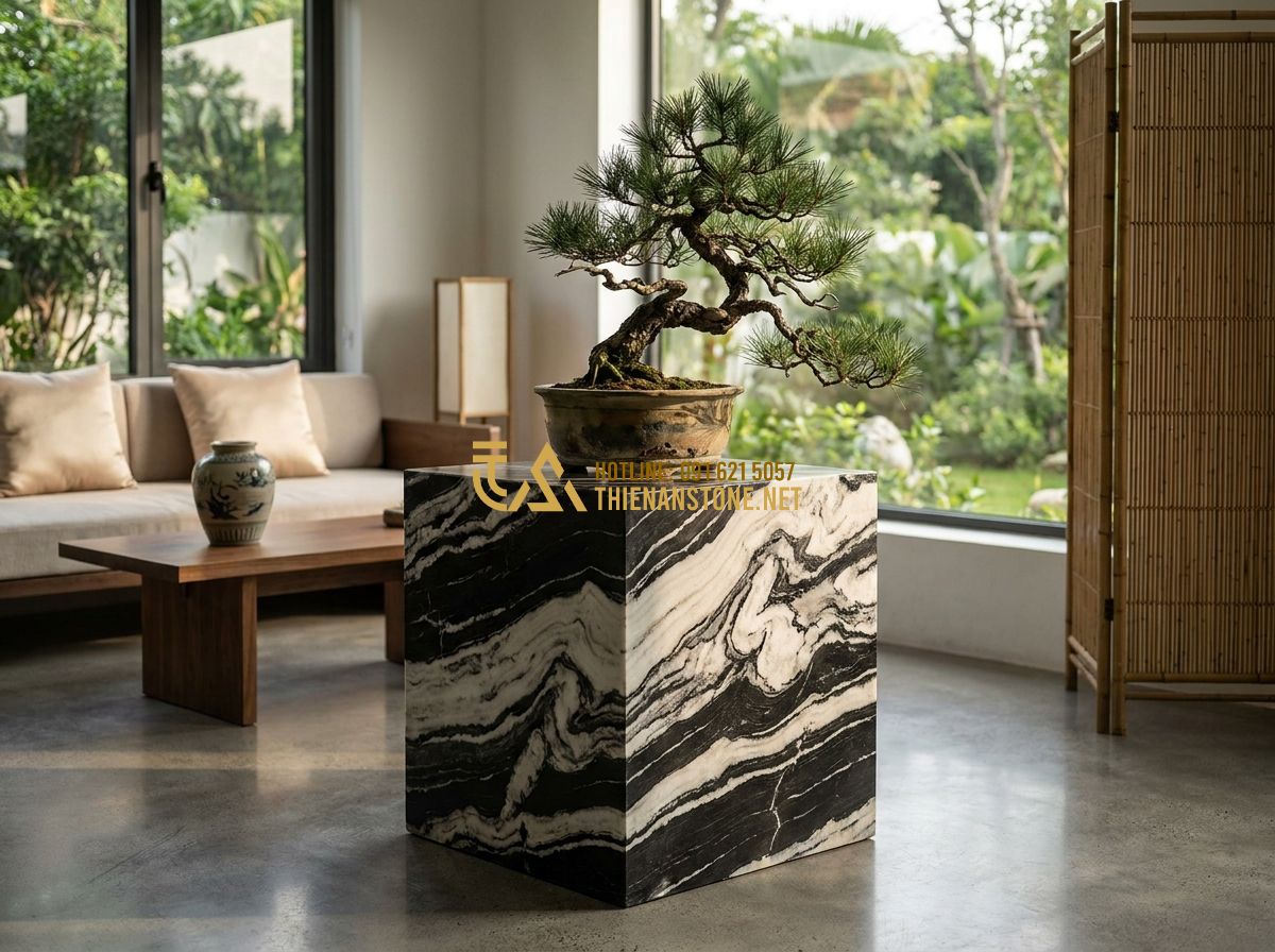 Đôn Đá Vuông Tự Nhiên Cao Cấp: Mẫu Đẹp Nhất Dùng Kê Cây Cảnh & Trang Trí Nội Thất 2026 - Hình 1 Đôn Đá Vuông Tự Nhiên Cao Cấp: Mẫu Đẹp Nhất Dùng Kê Cây Cảnh & Trang Trí Nội Thất 2026 - Tạo ảnh tiếng Anh: A high-end square natural stone pedestal placed in a minimali