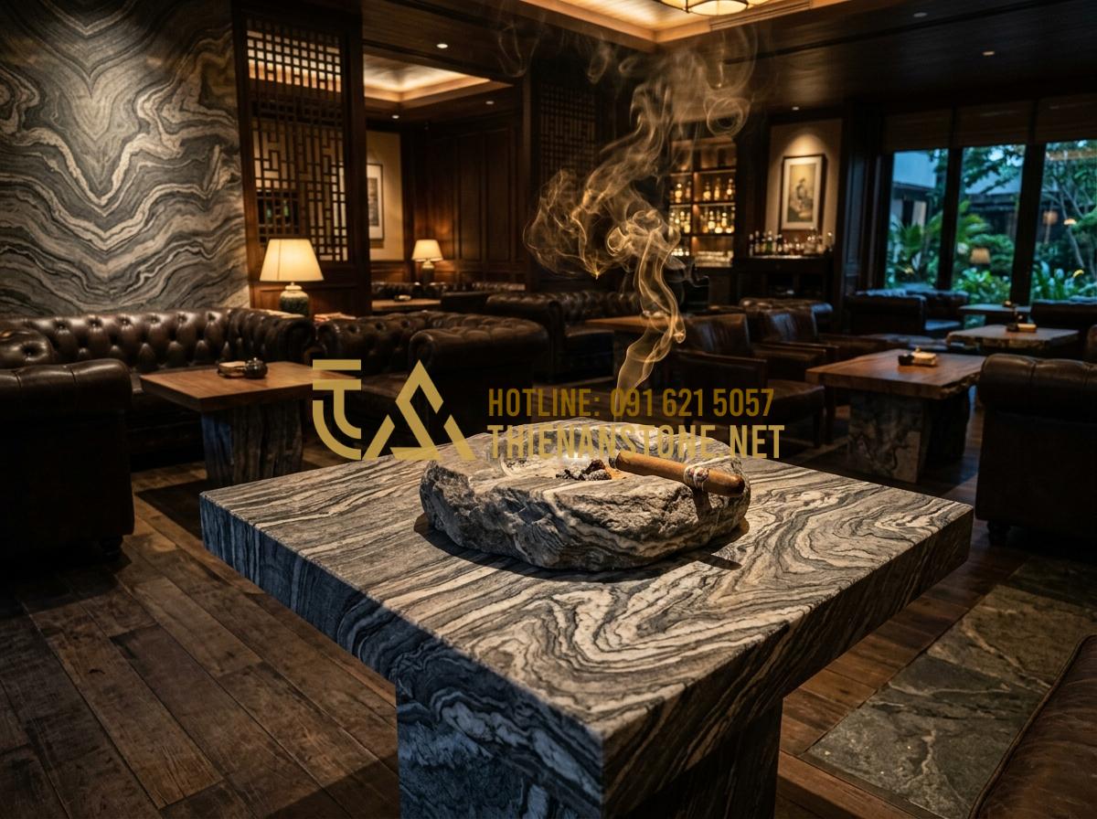 Gạt tàn độc đáo bằng đá tự nhiên: Món quà tặng sếp tinh tế và sang trọng - A wide shot of a luxury VIP cigar lounge, a large natural stone ashtray sits on