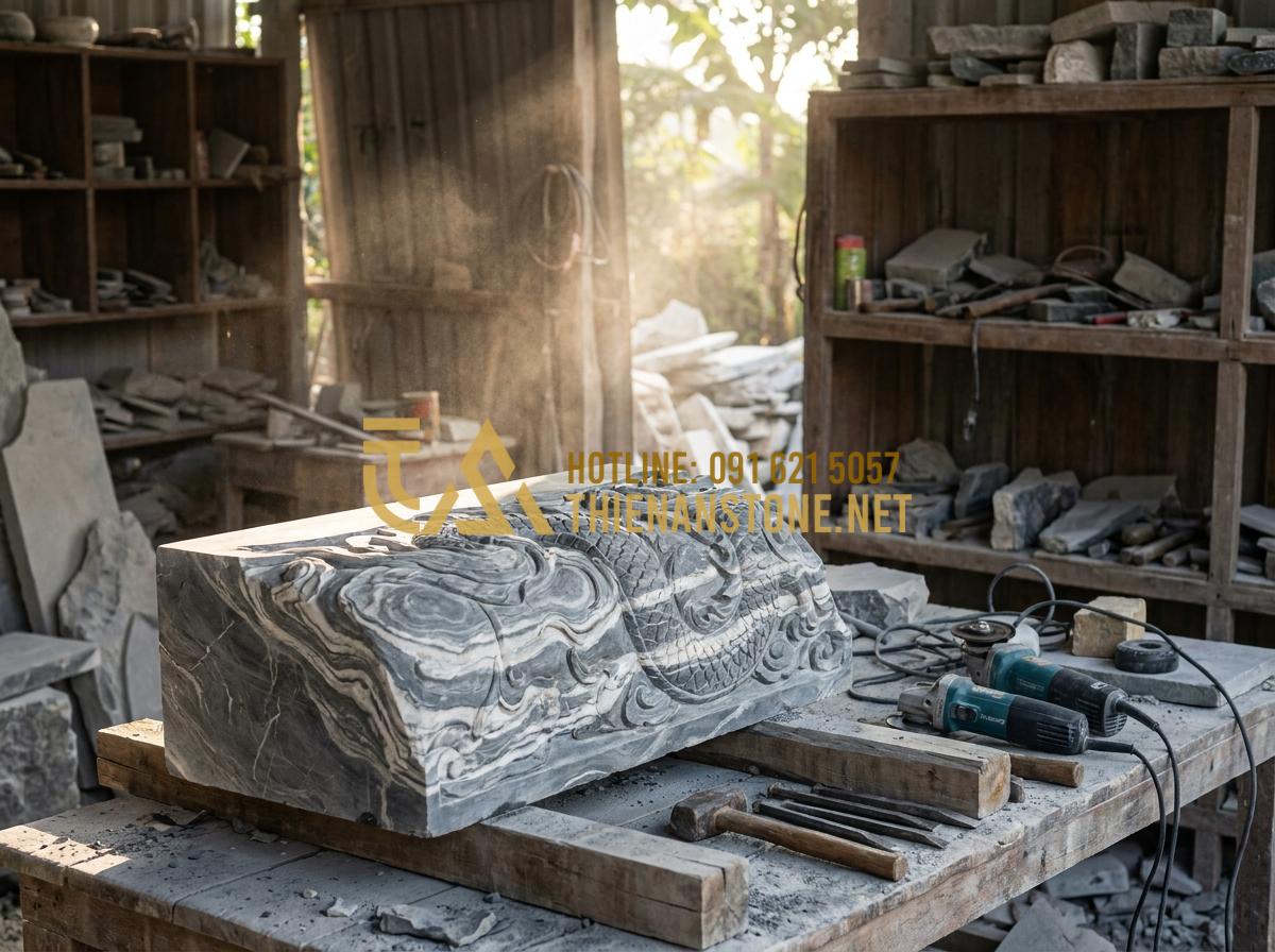 Giải Mã Giấc Mơ Thấy Bàn Thờ Thần Tài Đánh Con Gì Và Điềm Báo Cát Hung? - Hình 5 Giải Mã Giấc Mơ Thấy Bàn Thờ Thần Tài Đánh Con Gì Và Điềm Báo Cát Hung? - Tạo ảnh tiếng Anh: A professional craftsman at Thien An Stone workshop carefully