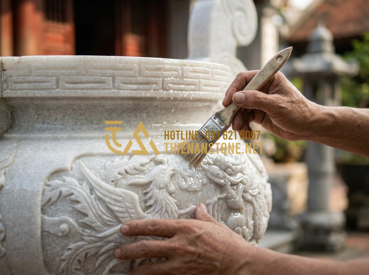 Hướng Dẫn Cách Vệ Sinh Bát Hương Đá Ngoài Trời Luôn Sáng Bóng Như Mới - Tạo ảnh tiếng Anh: A professional craftsman using a specialized soft brush and c
