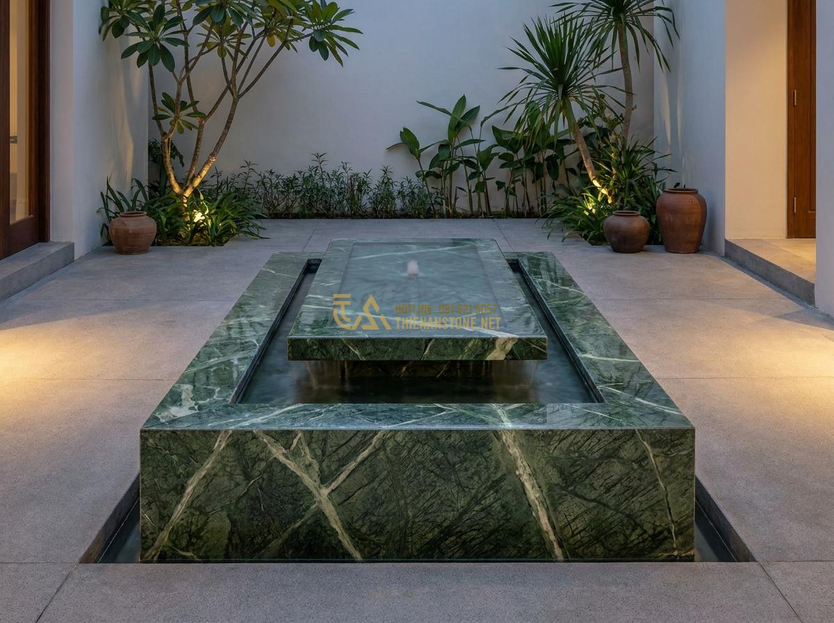 Hướng Dẫn Lắp Đặt Đài Phun Nước Bằng Đá Sân Vườn Đơn Giản Tại Nhà - Realistic photograph of a contemporary single-tier stone fountain with subtle wa