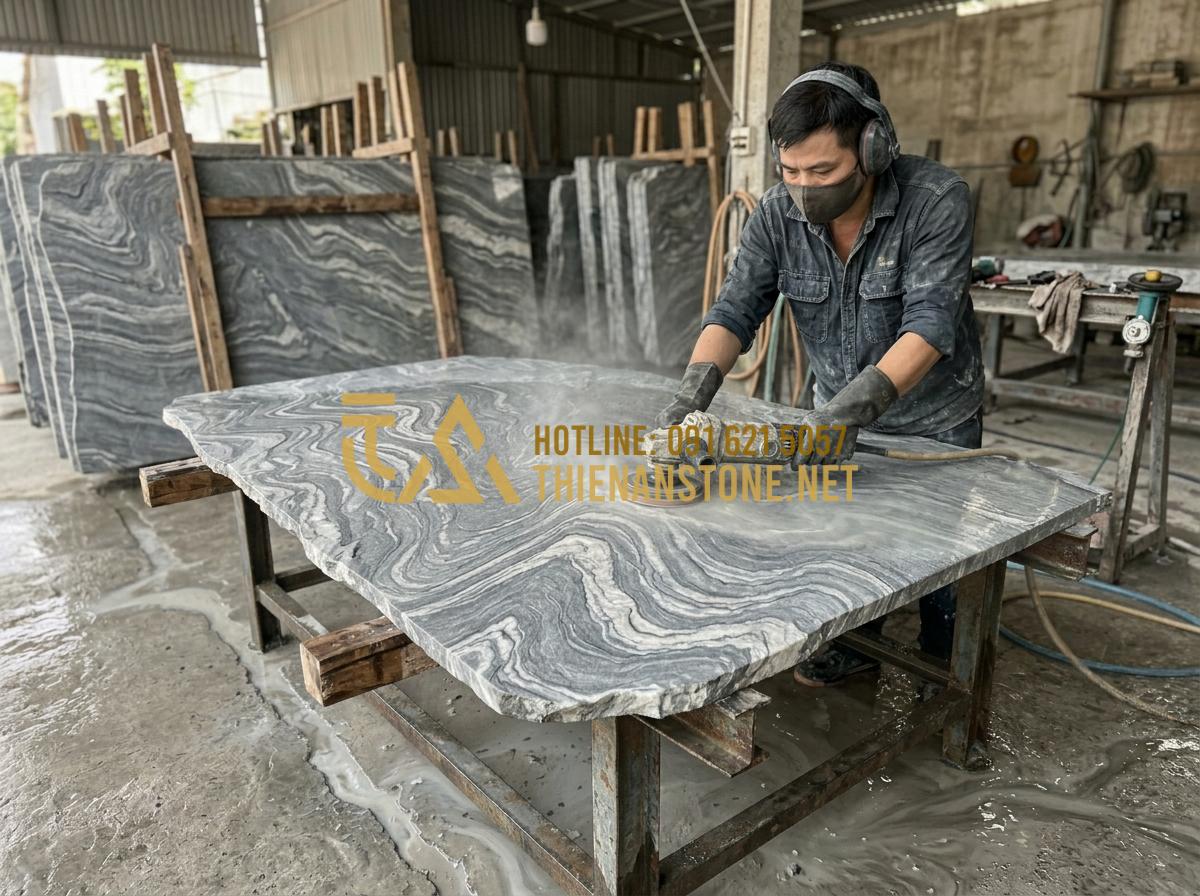 Hướng dẫn vệ sinh tranh đá tự nhiên xuyên sáng để giữ độ bóng bền lâu - Hình 7 Hướng dẫn vệ sinh tranh đá tự nhiên xuyên sáng để giữ độ bóng bền lâu - Tạo ảnh tiếng Anh: Skilled craftsmen at Thiên An Stone workshop working on a lar