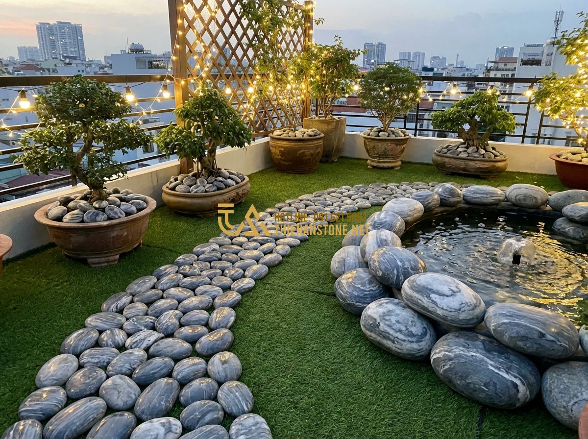Kích Thước Đá Cuội Vân Mây Phổ Biến Và Cách Chọn Đúng Ứng Dụng - Tạo ảnh tiếng Anh: A cozy and peaceful rooftop garden at dusk. There is a small