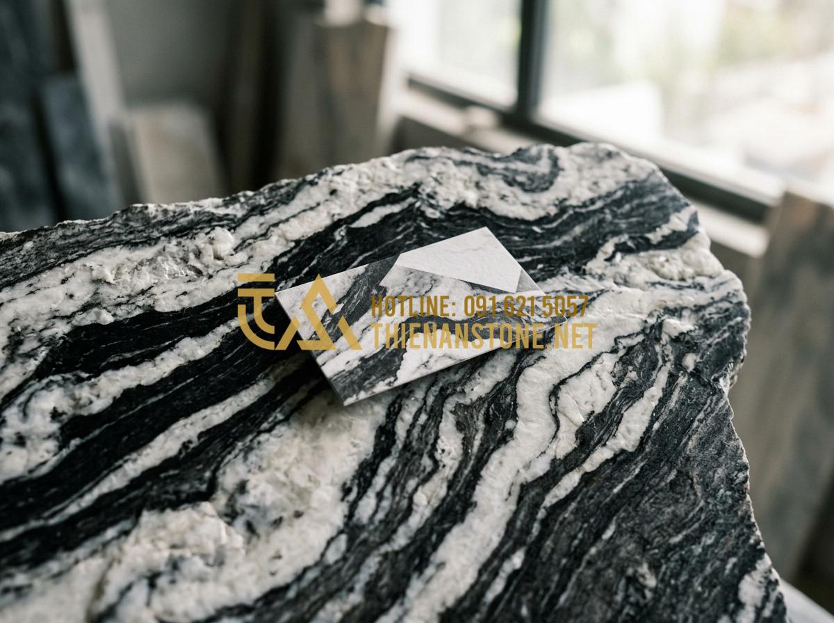 Kỹ thuật xây giếng đá ong cổ kính - Giữ trọn nét đẹp truyền thống Việt - Tạo ảnh tiếng Anh: A high-end business card design for Thien An Stone placed on
