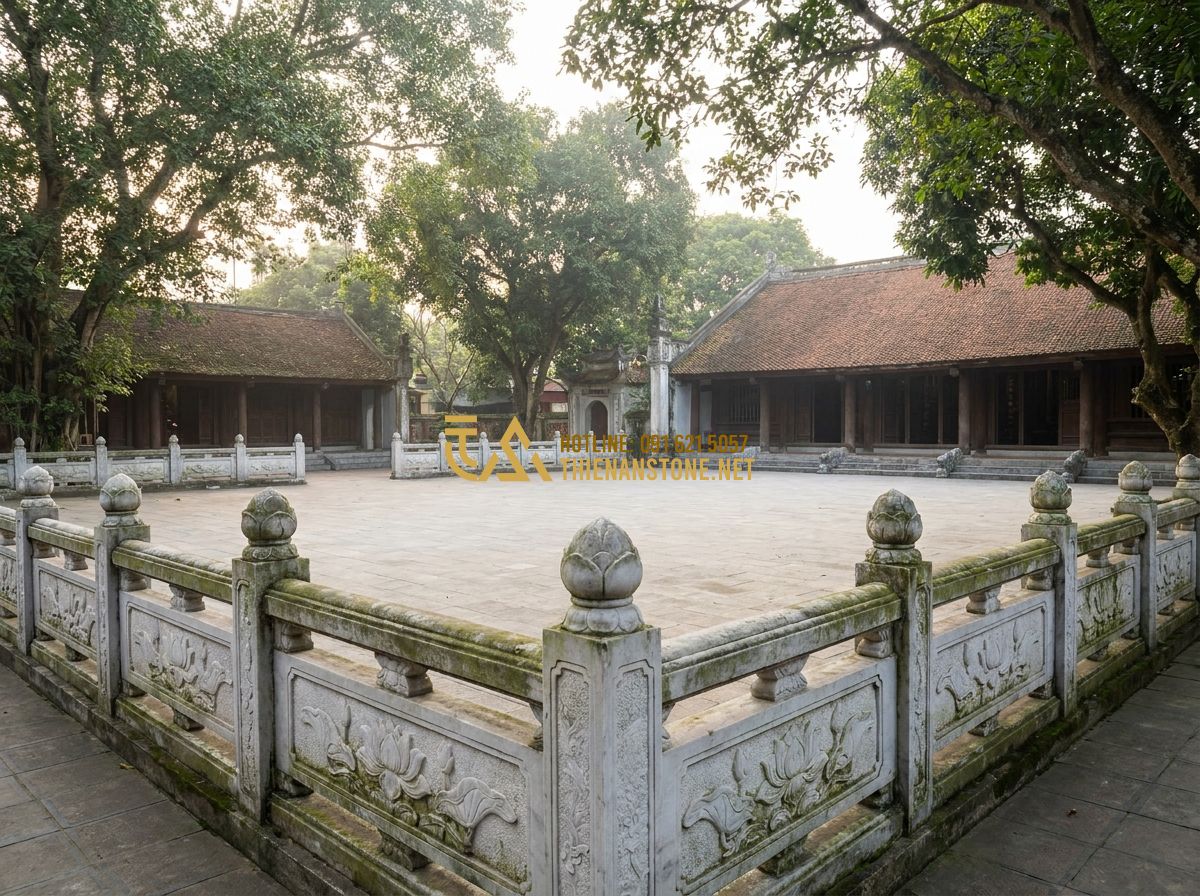 Lan Can Đá Trắng Tự Nhiên: Ưu Điểm & Mẫu Lan Can Đá Trắng Sang Trọng - Hình 2 Lan Can Đá Trắng Tự Nhiên: Ưu Điểm & Mẫu Lan Can Đá Trắng Sang Trọng - A wide shot of a traditional Vietnamese temple courtyard with intricately carved