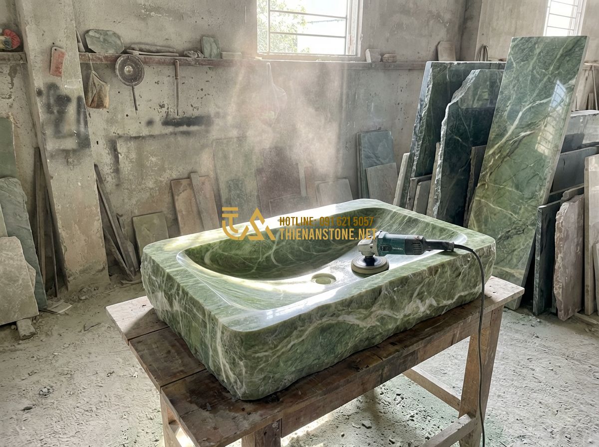 Lavabo Đá Tự Nhiên Âm Bàn Đá Hay Đặt Bàn Đá: Loại Nào Phù Hợp Với Không Gian Của Bạn? - Tạo ảnh tiếng Anh: A master craftsman in a workshop meticulously hand-polishing