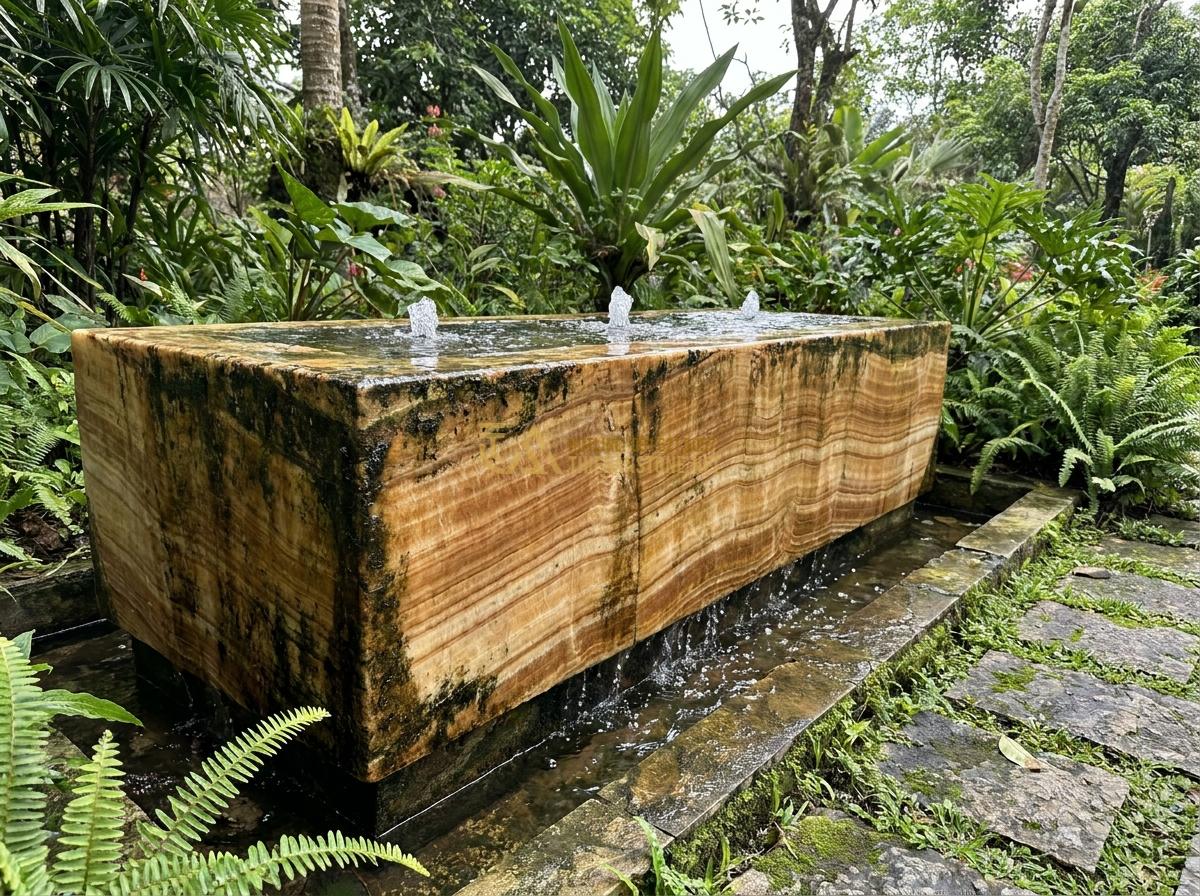 Lợi Ích Tuyệt Vời Khi Sử Dụng Đài Phun Nước Bằng Đá Trong Thiết Kế Tiểu Cảnh & Hồ Cá Koi - Durable granite stone fountain base resisting weather elements, with water jets
