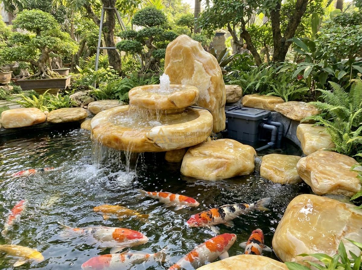 Lợi Ích Tuyệt Vời Khi Sử Dụng Đài Phun Nước Bằng Đá Trong Thiết Kế Tiểu Cảnh & Hồ Cá Koi - Functional stone fountain actively oxygenating a professional koi pond with mult