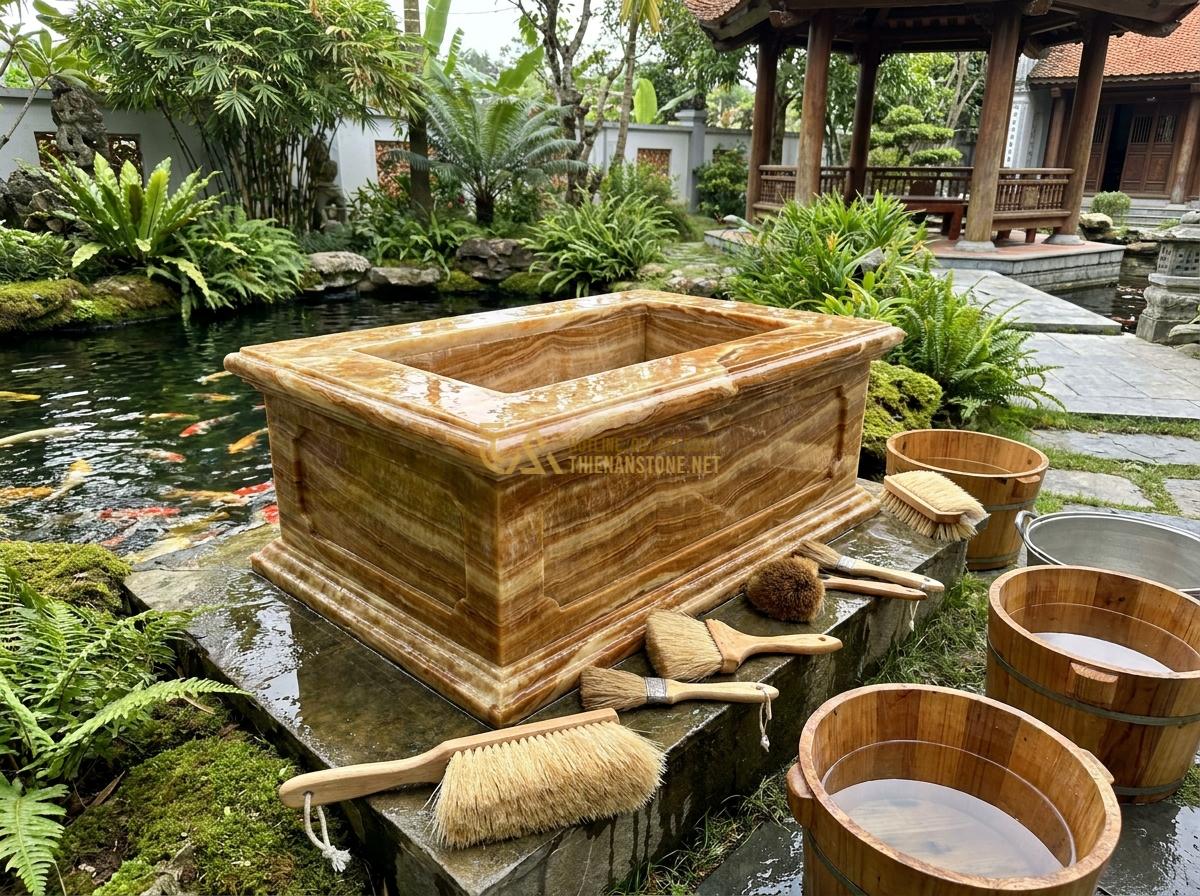 Lợi Ích Tuyệt Vời Khi Sử Dụng Đài Phun Nước Bằng Đá Trong Thiết Kế Tiểu Cảnh & Hồ Cá Koi - Maintenance scene of cleaning a stone fountain with soft brushes and water, pres