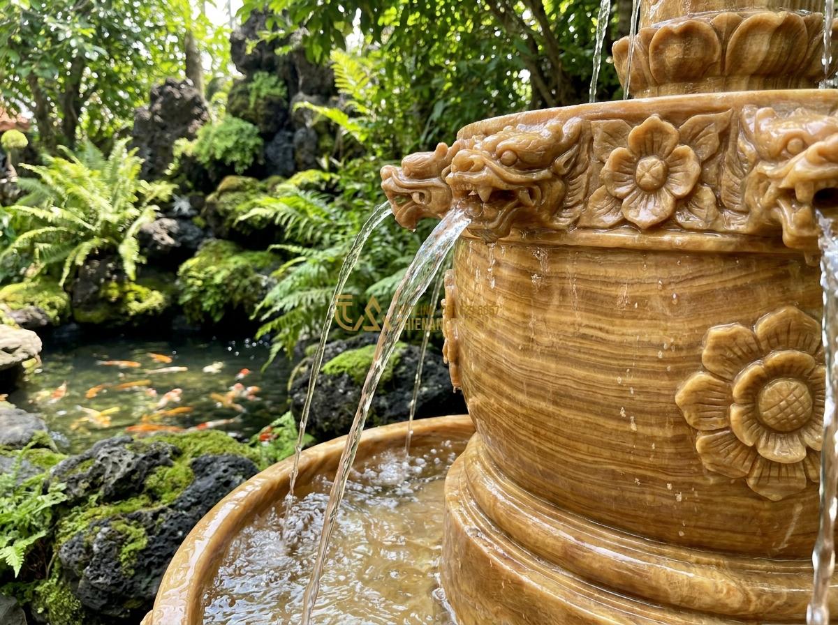 Lợi Ích Tuyệt Vời Khi Sử Dụng Đài Phun Nước Bằng Đá Trong Thiết Kế Tiểu Cảnh & Hồ Cá Koi - Detailed close-up of intricately carved stone water fountain spouting crystal cl