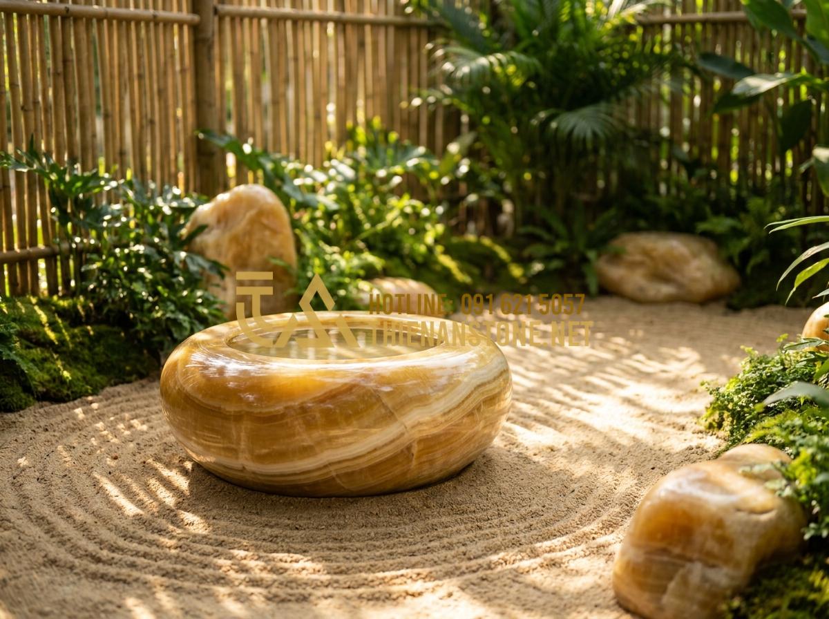 Lu đá trồng sen và nuôi cá: Tạo hệ sinh thái mini tuyệt đẹp trong lòng đá - Tạo ảnh tiếng Anh: A serene Zen garden scene featuring a stone water basin as th