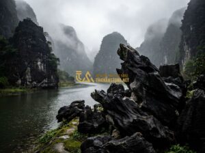 Mua Đá Lũa Đen Ở Đâu Uy Tín? Địa Chỉ Cung Cấp Đá Lũa Đen Ninh Bình Chất Lượng - Tạo ảnh tiếng Anh: A majestic landscape of Ninh Bình mountains where natural bla