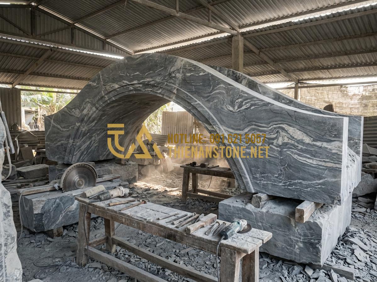 Nên chọn cầu đá tự nhiên hay cầu gỗ cho sân vườn? So sánh ưu nhược điểm chi tiết - Tạo ảnh tiếng Anh: Skilled stone artisans in a workshop carving a large monolith