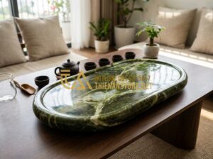 Nên Chọn Khay Trà Đá Hay Khay Trà Gỗ? Phân Tích Từ Chuyên Gia - A high-resolution image of an elegant natural stone tea tray placed on a modern