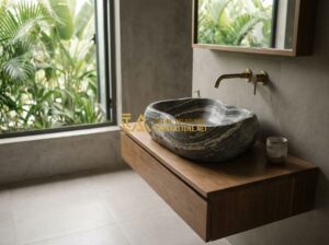 So Sánh Lavabo Đá Tự Nhiên Và Lavabo Đá Nhân Tạo: Nên Chọn Loại Nào? - Tạo ảnh tiếng Anh: A high-end, minimalist bathroom setting with a woman thoughtf