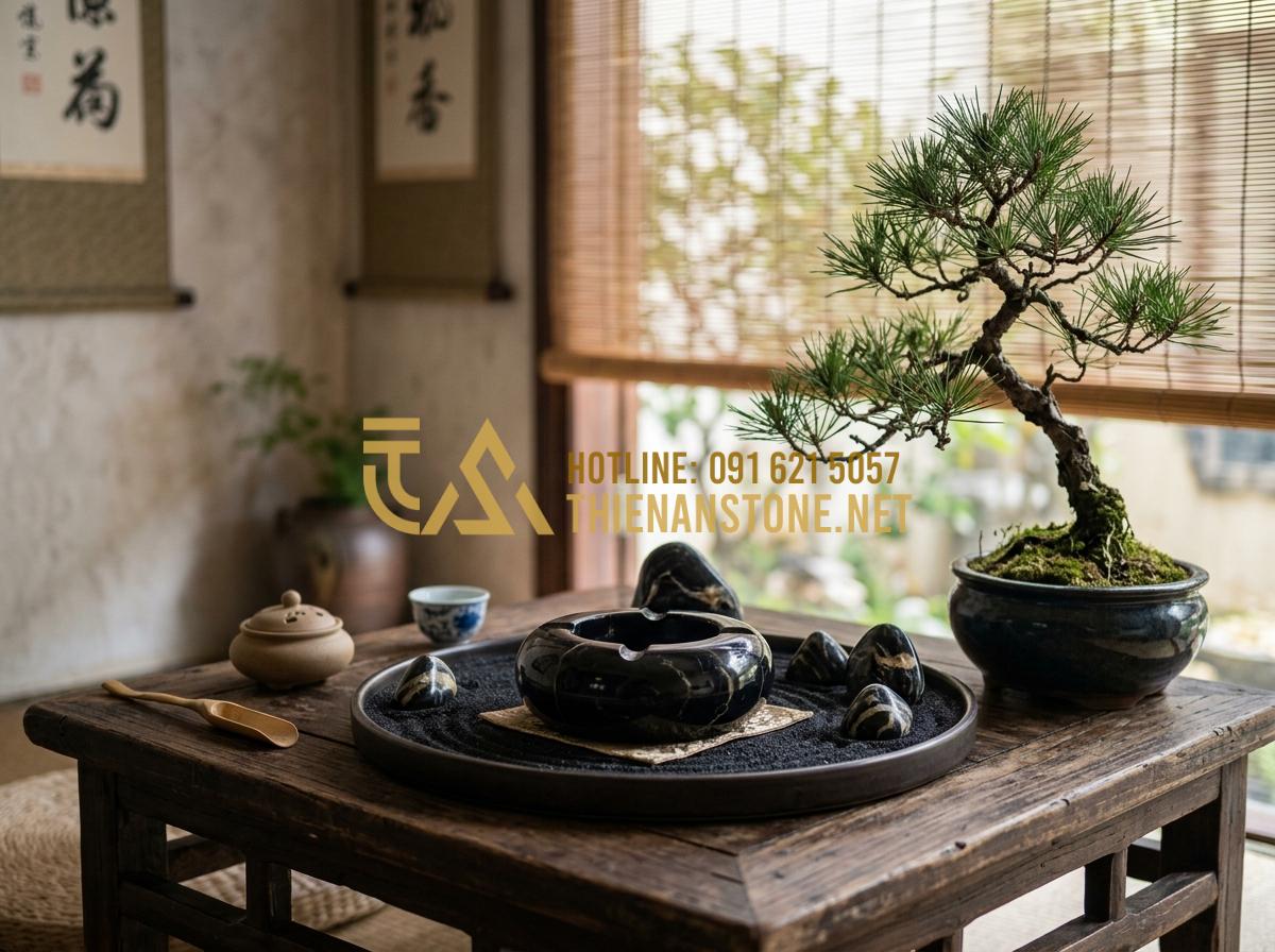 Tại sao gạt tàn đá tự nhiên lại bền và được ưa chuộng hơn gạt tàn sứ? - Tạo ảnh tiếng Anh: A serene Feng Shui setup on a low wooden tea table. A natural
