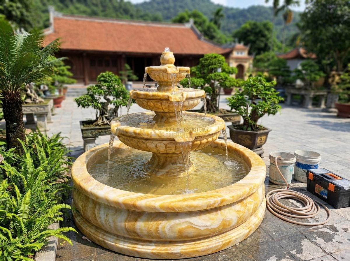 Thiết Kế & Thi Công Đài Phun Nước Bằng Đá Sân Vườn Chuẩn Phong Thủy | Quy Trình Chuyên Nghiệp - Hình 16 Thiết Kế & Thi Công Đài Phun Nước Bằng Đá Sân Vườn Chuẩn Phong Thủy | Quy Trình Chuyên Nghiệp - Team of skilled workers installing and testing a completed stone water fountain