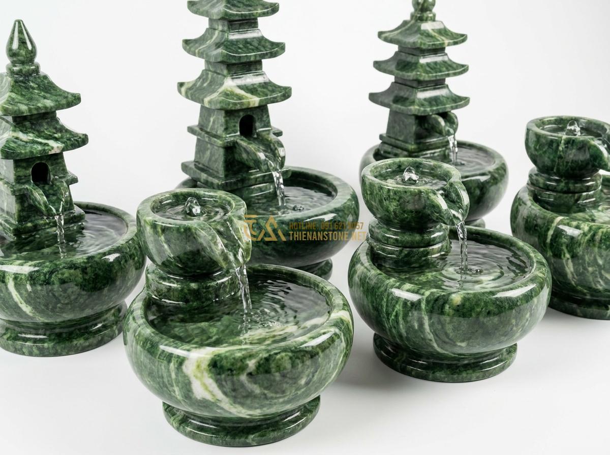 Thiết Kế & Thi Công Đài Phun Nước Bằng Đá Sân Vườn Chuẩn Phong Thủy | Quy Trình Chuyên Nghiệp - Hình 5 Thiết Kế & Thi Công Đài Phun Nước Bằng Đá Sân Vườn Chuẩn Phong Thủy | Quy Trình Chuyên Nghiệp - Detailed product photography of several mini stone water fountains in different