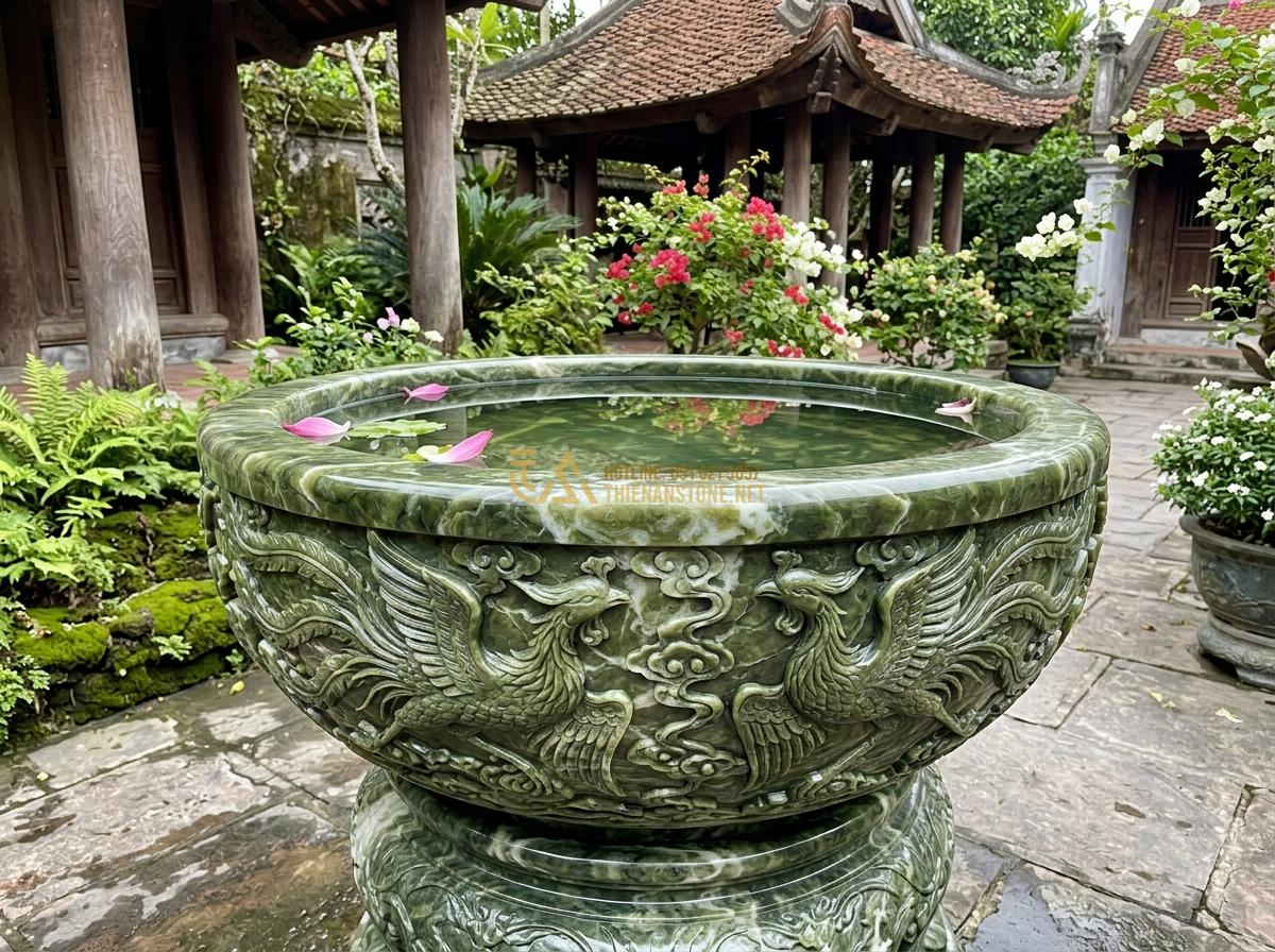 Top 15 Mẫu Ang Nước Bằng Đá Đẹp Nhất 2026 Cho Phong Thủy & Tiểu Cảnh Sân Vườn - Hình 19 Top 15 Mẫu Ang Nước Bằng Đá Đẹp Nhất 2026 Cho Phong Thủy & Tiểu Cảnh Sân Vườn - Artistic stone water basin carved with phoenix bird motifs in detailed granite c
